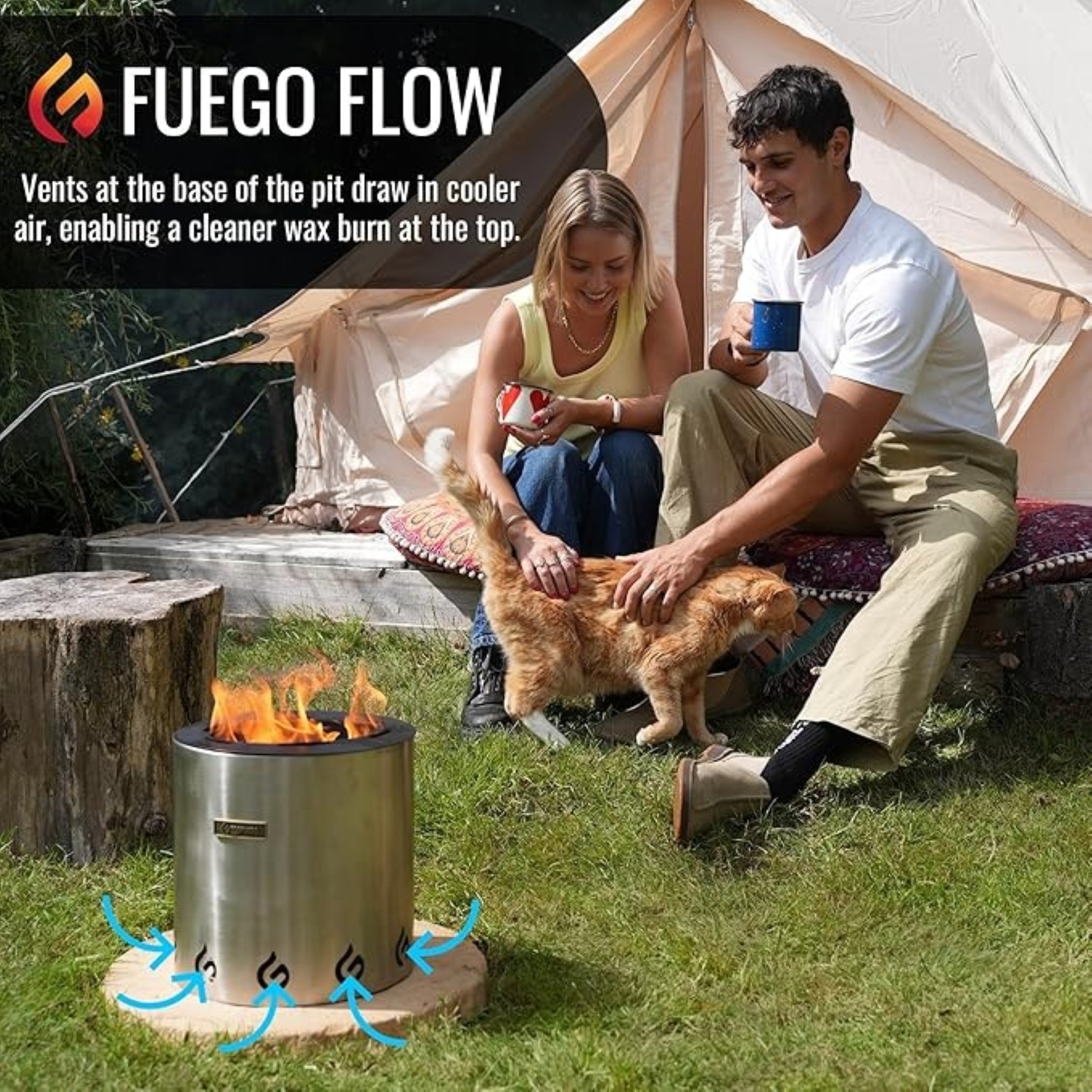 Two people sitting by a Fuego fire pit with a cat, near a tent.